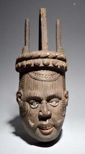 An Igbo mask Nigeria with carved details including…