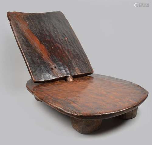 An Ethiopian low seat with an oblong seat raised o…