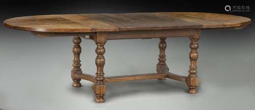 Antique style oak dining table with two leaves