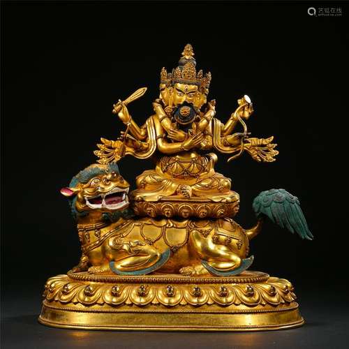 TIBETAN GILT BRONZE SEATED SIX ARM BUDDHIST GUARDIAN