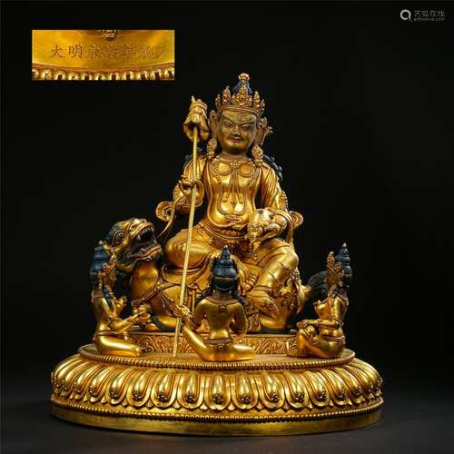 TIBETAN GILT BRONZE SEATED BUDDHIST GUARDIAN