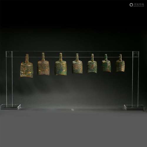 A SET OF SEVEN CHINESE GILT BRONZE RITAL BELL