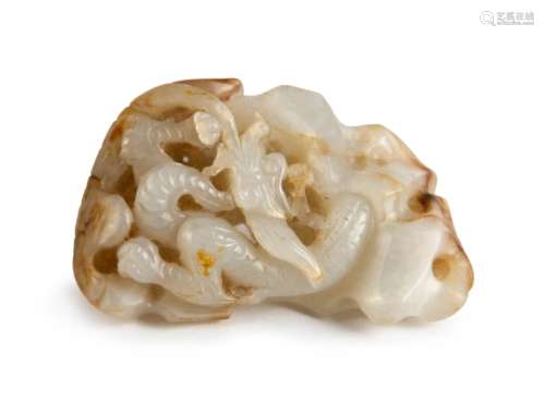 A WHITE CARVED JADE OPENWORK ‘DRAGON’ TOGGLE