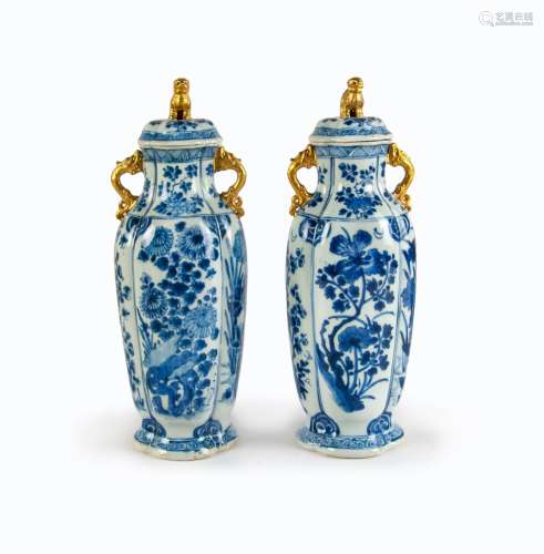 PAIR OF BLUE AND WHITE GILDED LIDDED JARS