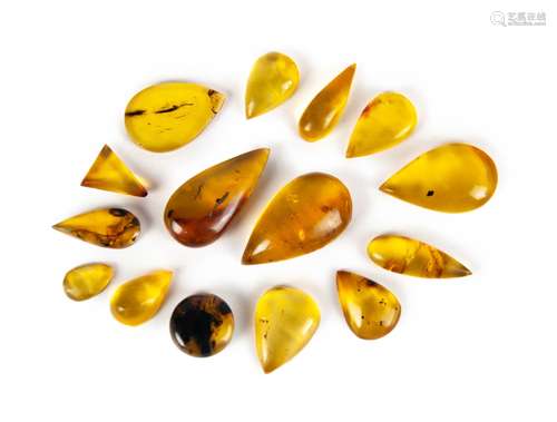 GROUP OF FIFTEEN GOLD AND BLUE DOMINICAN AMBER