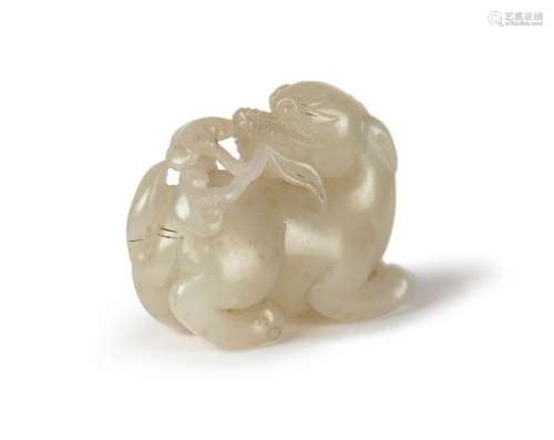 A CHINESE CARVED JADE BEAST WITH LINGZHI