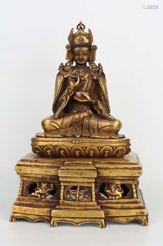 A GILT-BRONZE FIGURE OF PADMASAMBHAVA.ANTIQUE