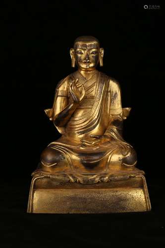 A GILT-BRONZE FIGURE OF GURU.ANTIQUE