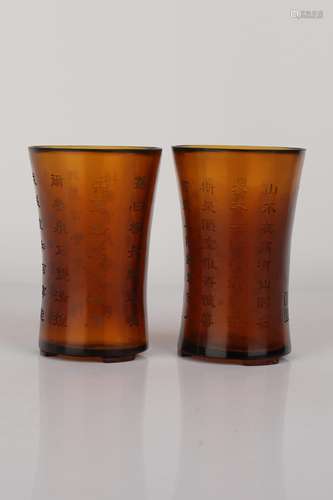 A PAIR OF CARVED AMBER GLASS BRUSHPOTS.ANTIQUE