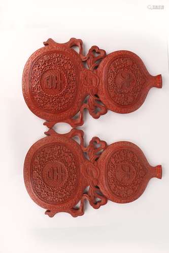 A PAIR OF CINNABAR LACQUER DOUBLE-GOURD WALL PLAQUES.ANTIQUE