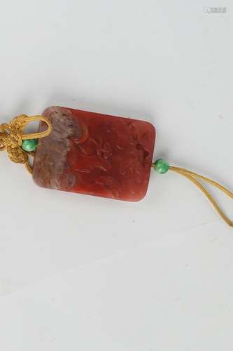 A CARVED RED AGATE PENDANT.ANTIQUE