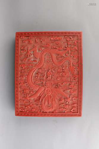 A CINNABAR LACQUER 'DRAGON' BOX AND COVER.ANTIQUE