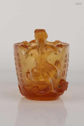 A CARVED AMBER GLASS CUP.ANTIQUE