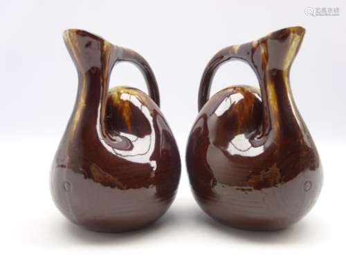 Pair of pottery camel hump jugs in the style of Christopher Dresser with incised band of rosettes