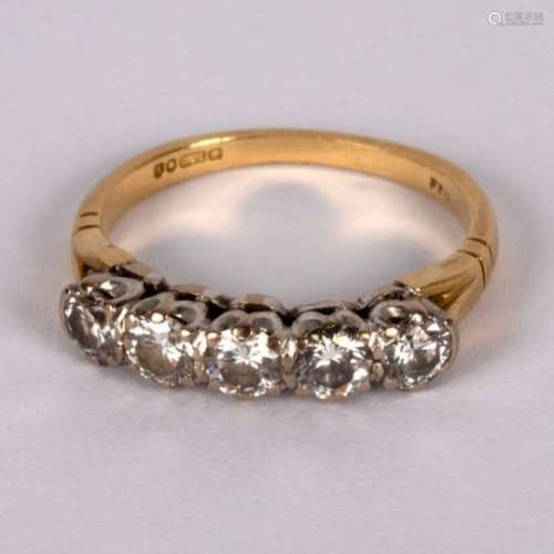 A diamond five-stone ring, claw set in white metal to an 18ct yellow gold shank,