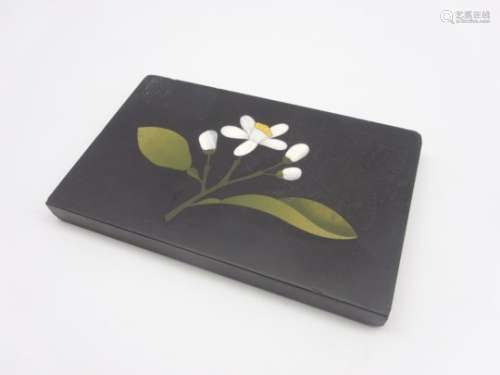 Florentine pietra dura plaque inlaid with a floral design in jasper and other hardstones on a black