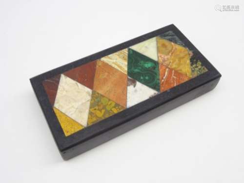 Pietra dura plaque inlaid with coloured hardstones in a geometric design 9cm x 17cm