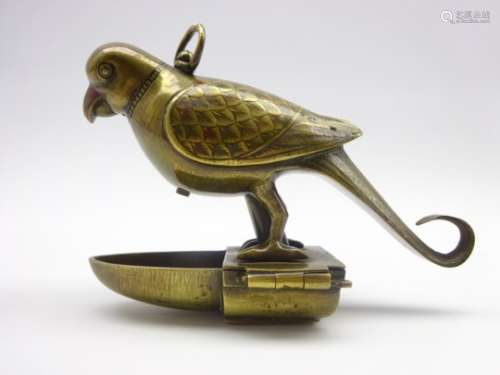 Persian brass cage bird water feeder in the form of a perching bird with engraved decoration H10cm