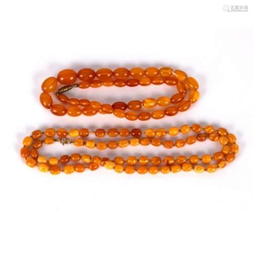 A single row of Baltic amber barrel shaped beads, 72cm long,