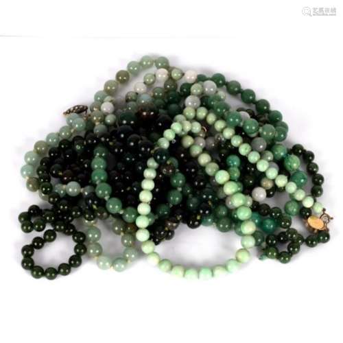 Eight hardstone bead necklaces, ranging in colour from pale celadon to spinach green,