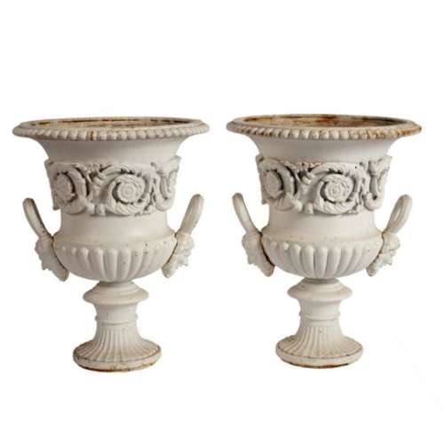 A pair of cast iron campana shaped urns, painted white,
