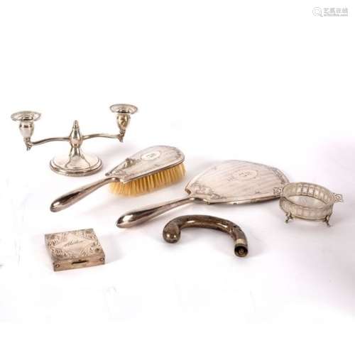 A Canadian silver-backed hand mirror by Birks, a matching hairbrush,