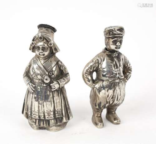 A pair of Dutch 800 standard silver pepper pots, modelled as a boy and a girl, circa 1880,