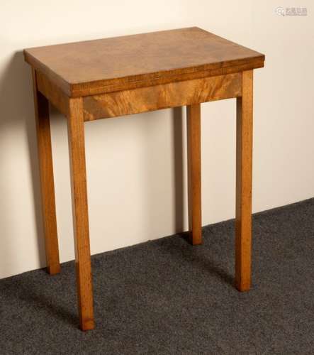 A walnut tea table with swivel two-tier top,