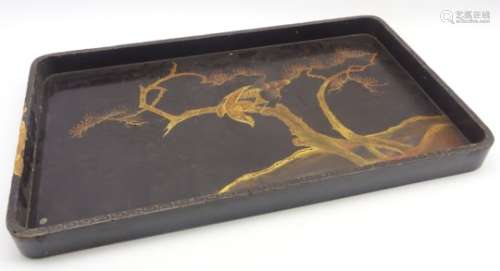 19th Century lacquered rectangular tray decorated in gilt with a Japanese landscape 66cm x 38cm