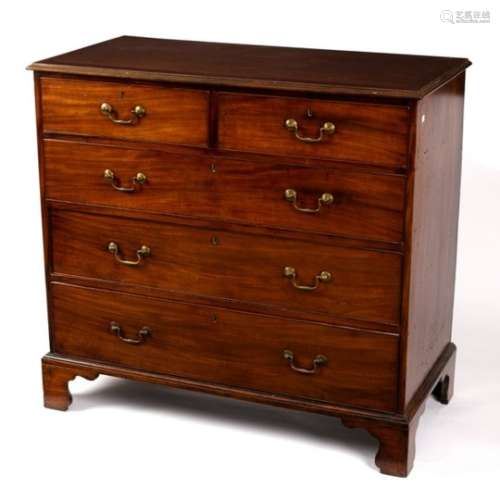 A George III mahogany chest of three long and two short drawers, on bracket feet,