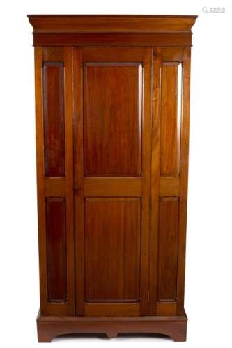 A mahogany wardrobe with central panel door,
