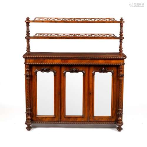 A Regency rosewood chiffonier with shelves over, enclosed by three mirror doors,