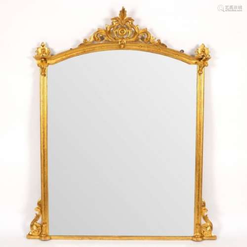 An arch-top gilded overmantel mirror with moulded border,