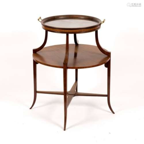 An Edwardian mahogany circular two-tier table, with platform base and splay feet,