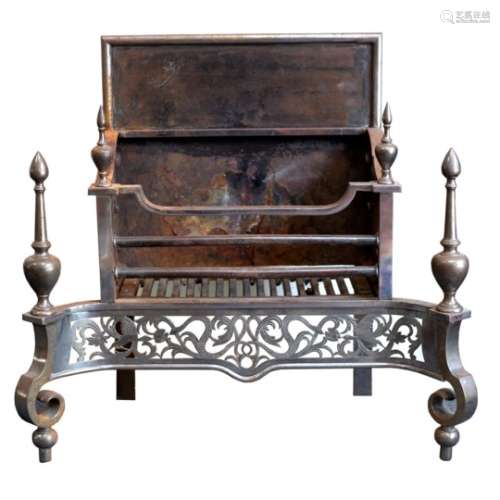 A burnished steel fireplace of Adam design, with pierced apron and turned finials,