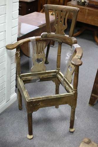 An 18th Century oak corner chair with later splat back head rest,