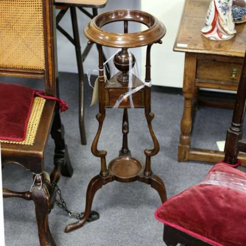 A George III mahogany tripod wash stand with drawer to undertier,