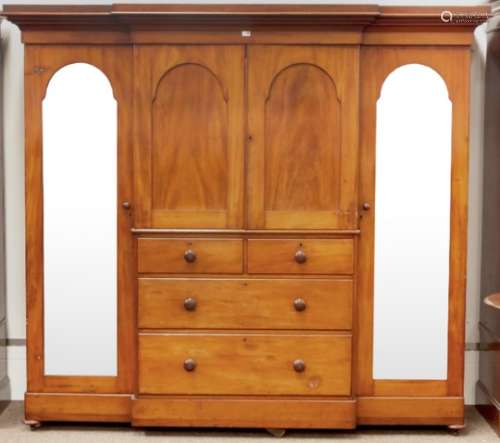 Victorian mahogany break front triple wardrobe, projecting cornice above two paneled doors,