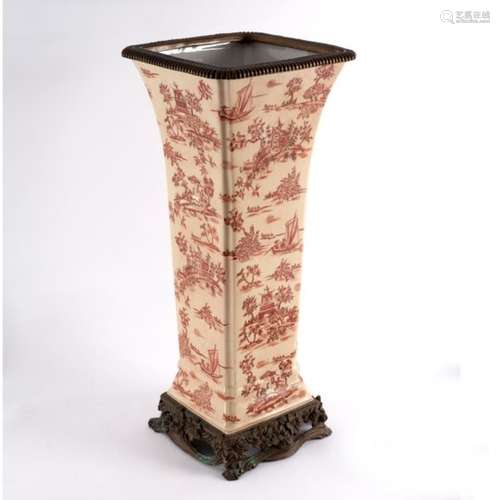 A continental ceramic square tapering vase with fluted corners,