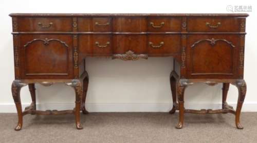 Queen Anne style burr walnut serpentine sideboard, cross banded top with carved and moulded edge,