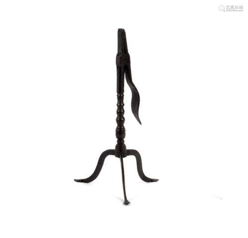 An 18th Century wrought iron rush-light holder with wavy sprung handle on a bobbin-turned column