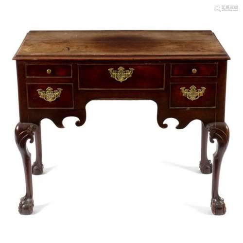 A George II walnut lowboy fitted five drawers, on carved cabriole legs with ball and claw feet,