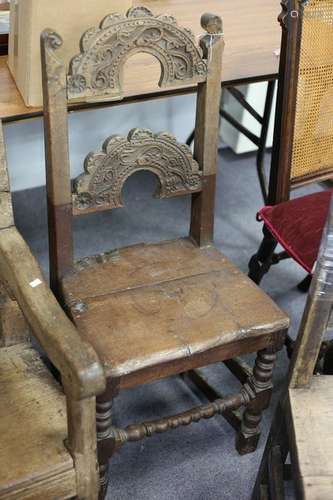 A 17th Century oak single chair with foliate carved arch shaped splats,