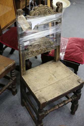 A 17th Century oak single chair with scroll carved arch-shaped splats,