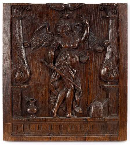 A 17th Century carved oak panel depicting a figure of Justice holding scales and a sword,