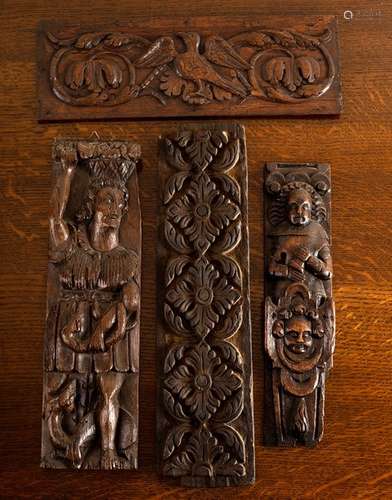 A 17th Century carved oak panel of a man with a basket on his head clasping a serpent in his left