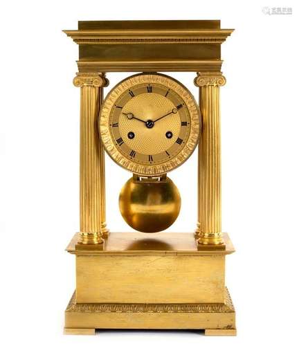 An Empire ormolu portico clock with four Ionic column supports,