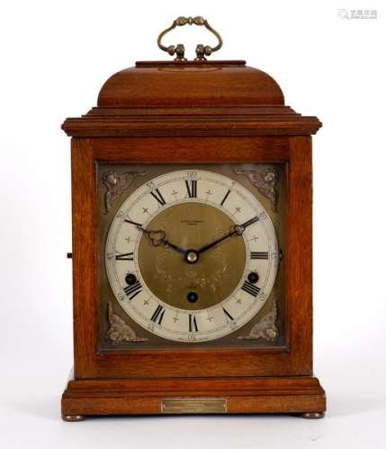 An Elliott eight-day mantel clock, dial signed Arthur Saunders, London, in a mahogany case,