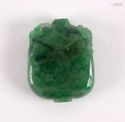 A Chinese jadite snuff bottle of rectangular section carved with Kylin shoulders,