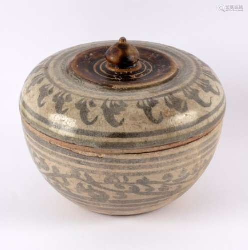 A Persian pottery bowl and cover with foliate and stylised decoration,